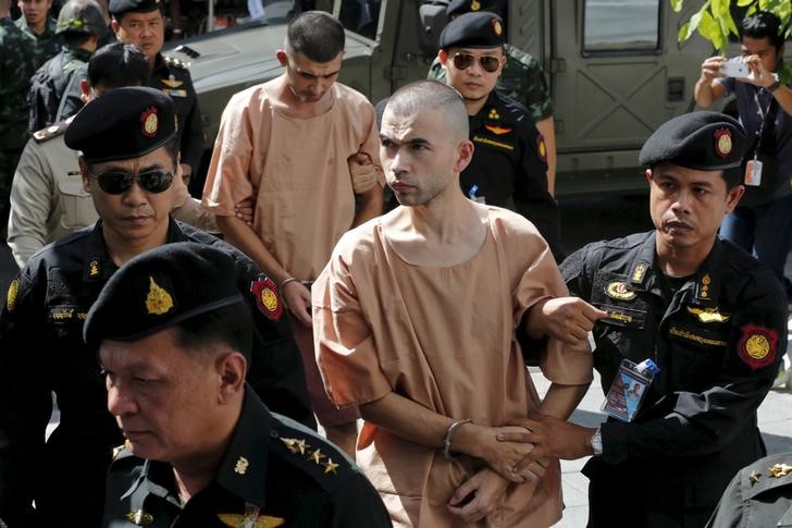 © Reuters. File photo of the suspects of the August 17 Bangkok blast being escorted as they arrive at the military court in Bangkok