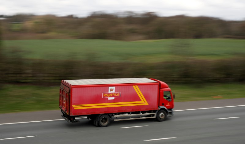 © Reuters. A Royal Mail vehicle drives along the M6 motorway near Knutsford, northern England.