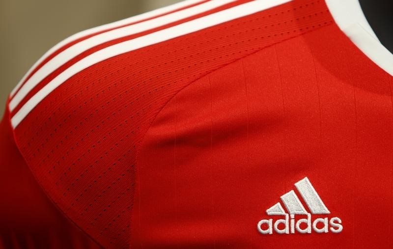 © Reuters. Adidas logo is pictured at shirt before company annual general meeting in Fuerth