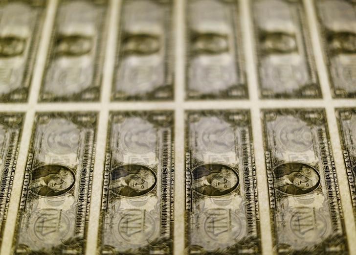 © Reuters. File photo of United States one dollar bills seen on a light table at the Bureau of Engraving and Printing in Washington