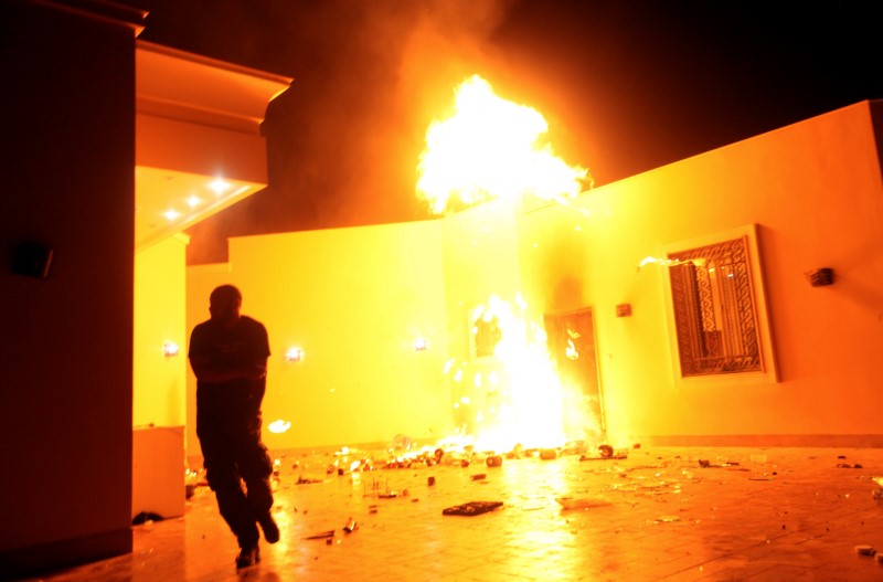 © Reuters. The U.S. Consulate in Benghazi is seen in flames during a protest