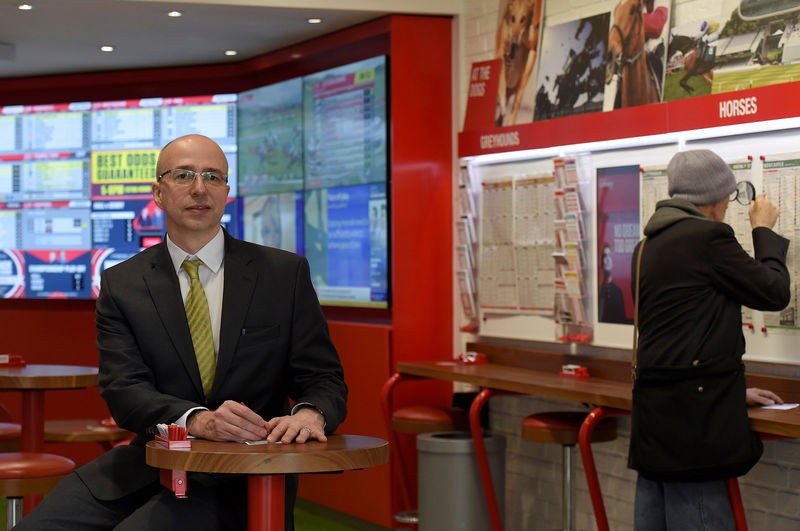 © Reuters. Alistair Meeks poses for a portrait at a branch of Ladbrokes  in central London, Britain