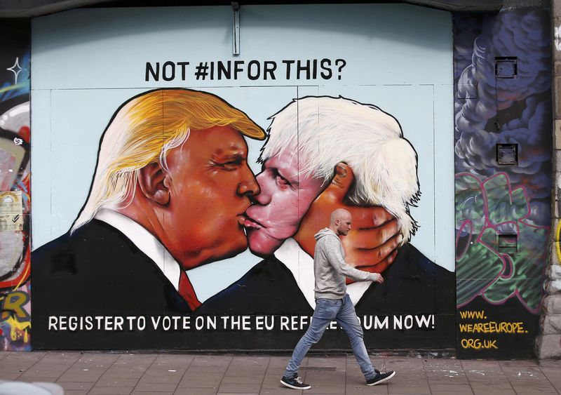 © Reuters. A mural of Donald Trump embracing Boris Johnson is seen on a building in Bristol