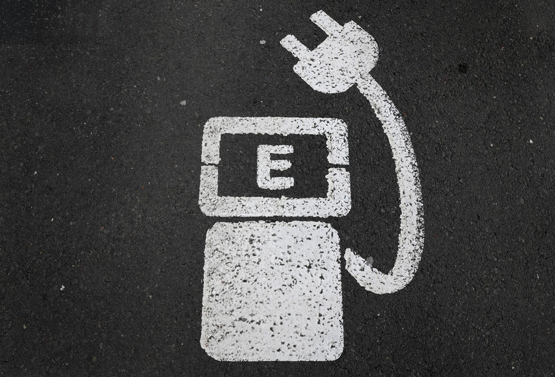 © Reuters. File photo of a battery charger sign for electric cars painted on the ground of a parking ground near the soccer stadium in Wolfsburg