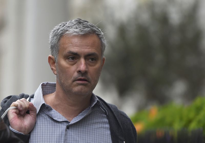© Reuters. Former Chelsea manager Jose Mourinho walks towards his house in London