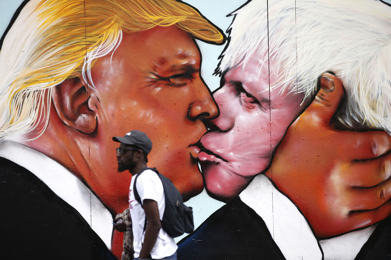 © Reuters. A mural of Donald Trump embracing Boris Johnson is seen on a building in Bristol