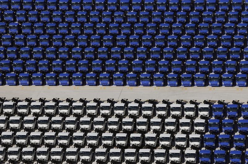 © Reuters. Trucks are parked at the Gioia Tauro commercial harbour