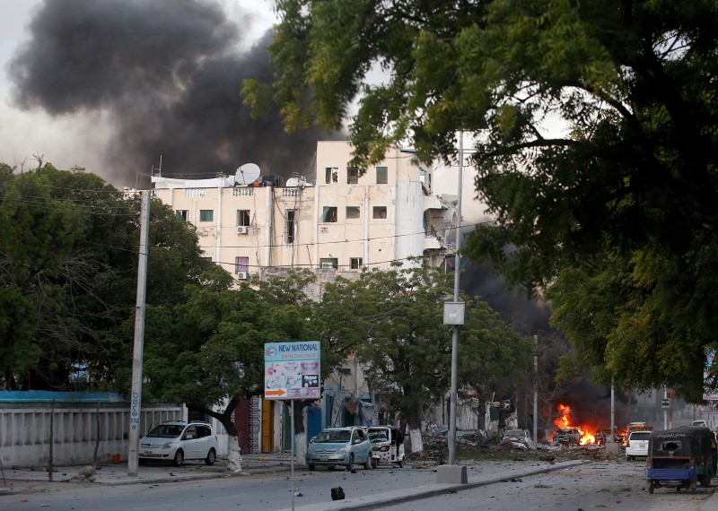 © Reuters. A general view shows the scene of a suicide car bombing outside Hotel Ambassador on Maka Al Mukaram Road in Somalia's capital Mogadishu