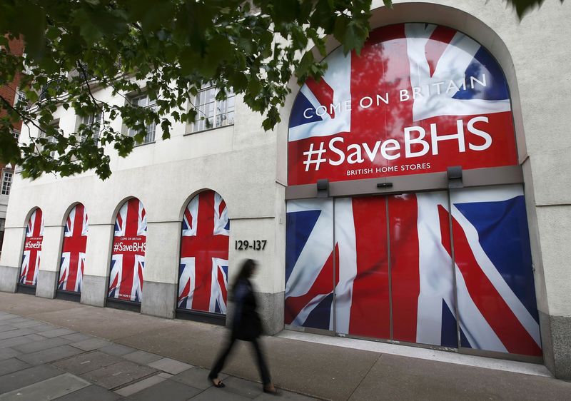 © Reuters. A person walks past the headquarters of retailer British Home Stores after it was announced that BHS is to be wound down after administrators failed to find a buyer for the 88-year-old retailer, in central London