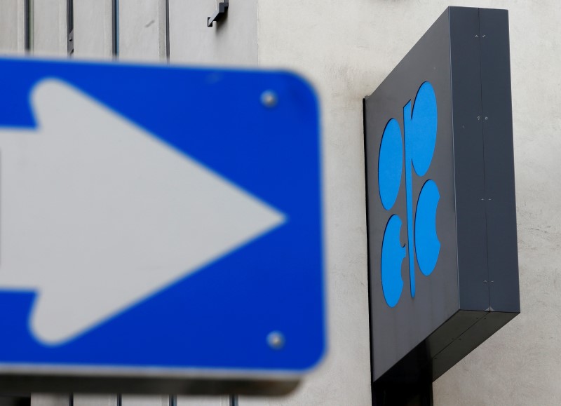 © Reuters. The OPEC logo is pictured behind a traffic sign at its headquarters in Vienna