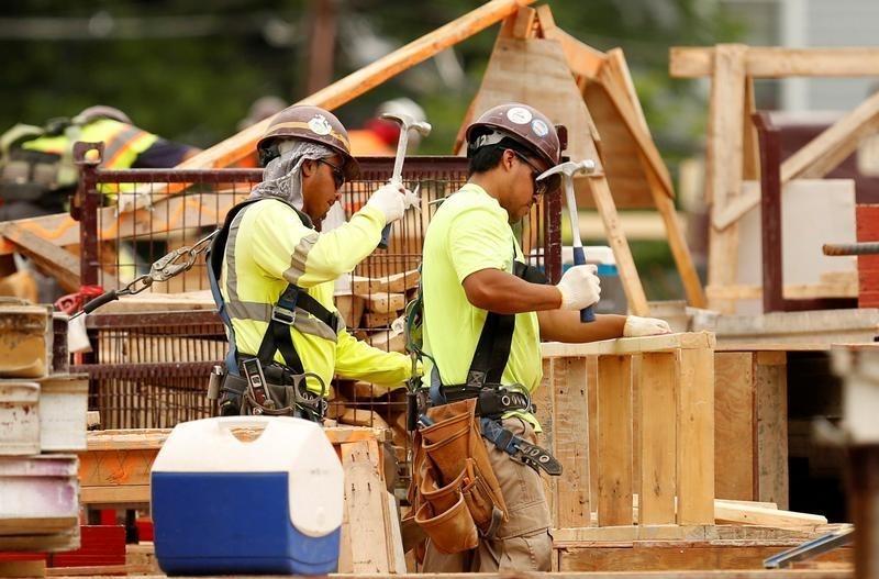 © Reuters. Construction workers are seen at a new building site in Silver Spring, Maryland