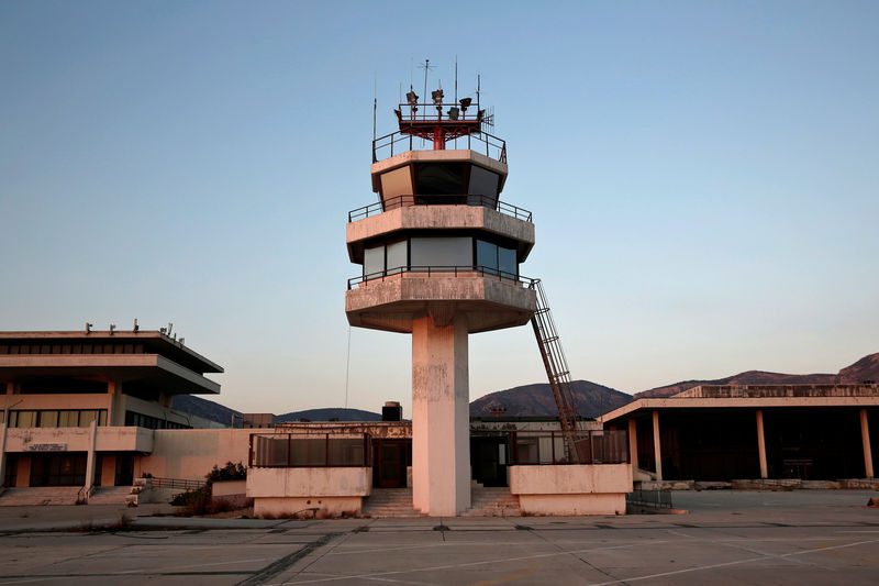 © Reuters. An auxiliary control tower stands in front of the east terminal of the former Athens International airport, Hellenikon