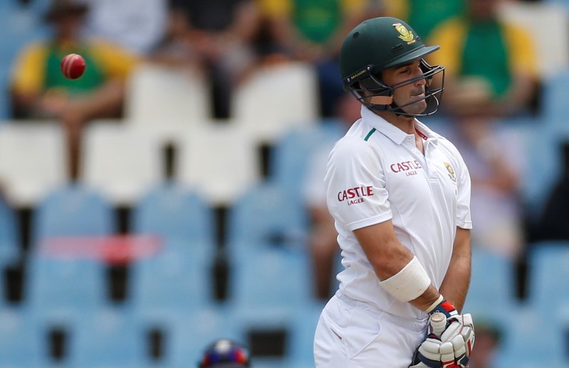 © Reuters. South Africa's Elgar ducks a delivery during the fourth cricket test match against England at Centurion