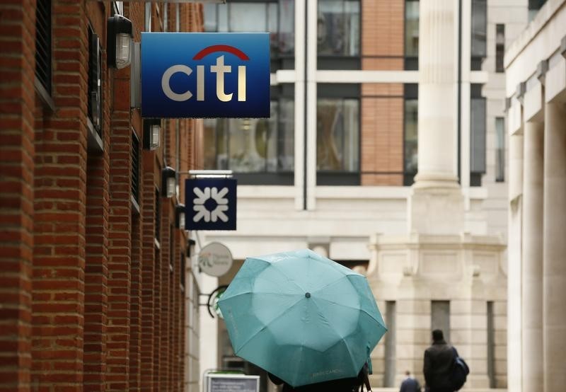 © Reuters. People walk past a Citibank branch in the City of London