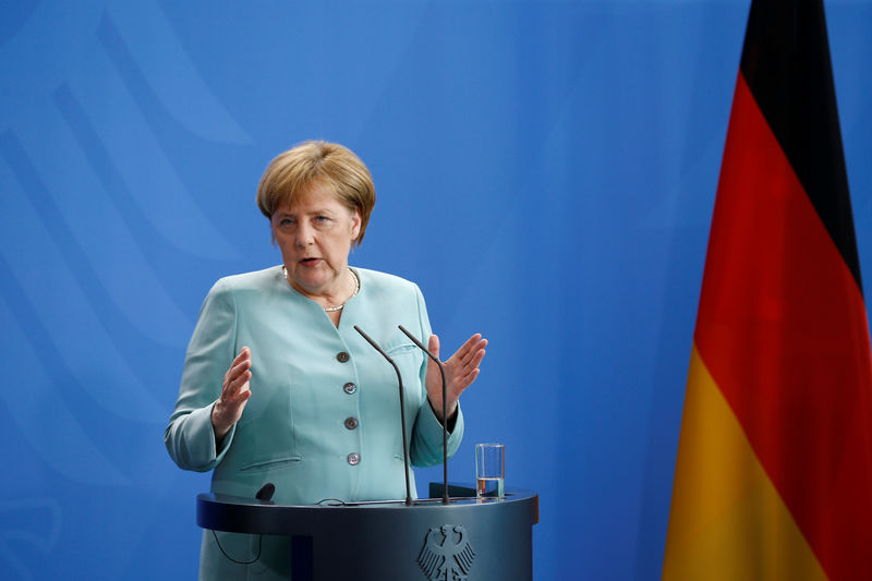 © Reuters. German Chancellor Merkel attends a news conference following talks with President of Azerbaijan Aliyev in Berlin