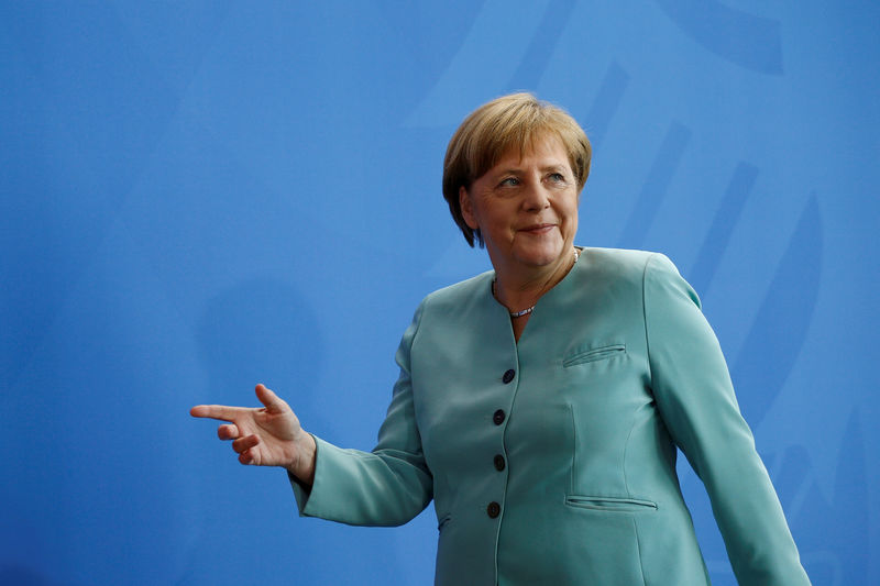 © Reuters. German Chancellor Merkel attends a news conference following talks with President of Azerbaijan Aliyev in Berlin