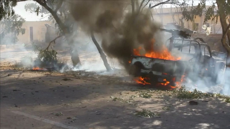 © Reuters. Still image of a vehicle burning as forces aligned with Libya's new unity government advance on the eastern and southern outskirts of the Islamic State stronghold of Sirte