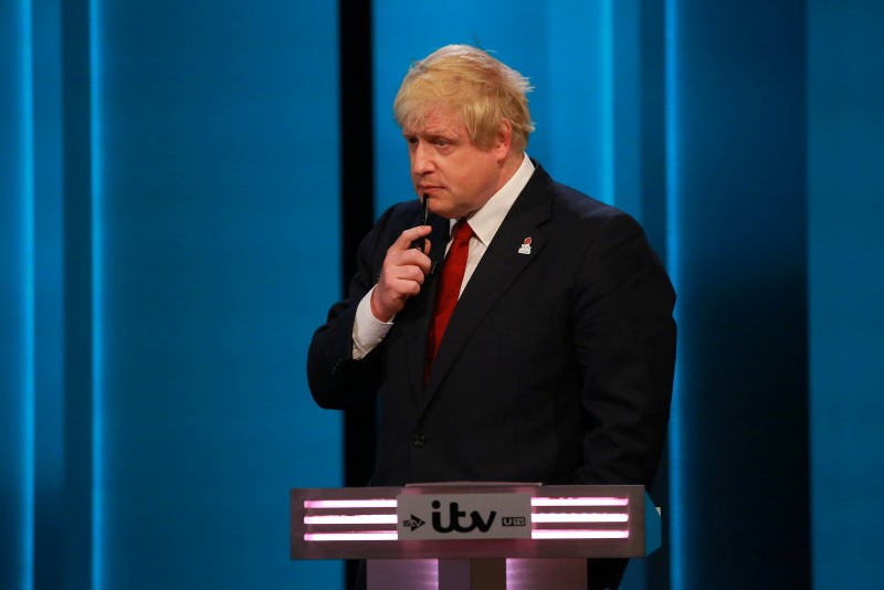 © Reuters. Former Mayor of London Boris Johnson gestures during the "The ITV Referendum Debate" at the London Television Centre in Britain