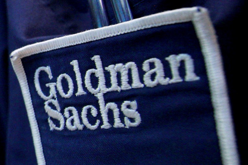 © Reuters. The logo of Dow Jones Industrial Average stock market index listed company Goldman Sachs (GS) is seen on the clothing of a trader working at the Goldman Sachs stall on the floor of the New York Stock Exchange