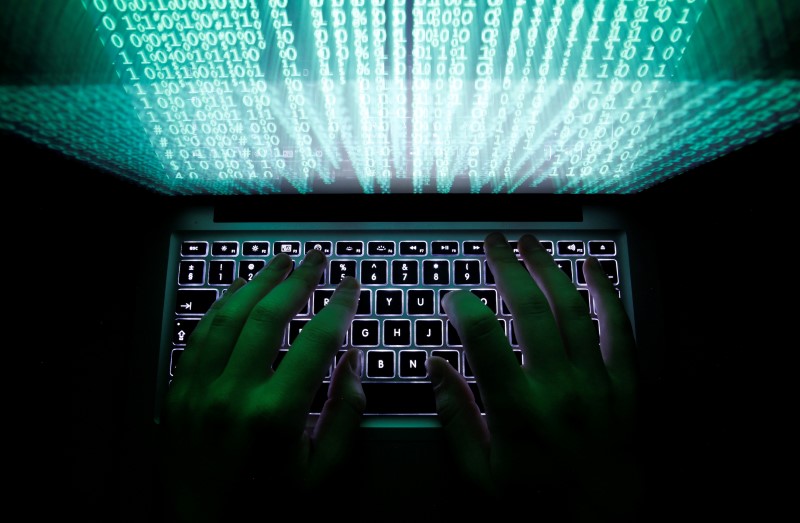 © Reuters. Illustration file picture shows a man typing on a computer keyboard in Warsaw