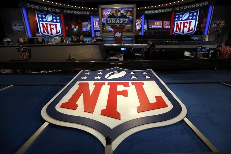 © Reuters. NFL logo and set are seen at New York's Radio City Music Hall before the start of the 2013 NFL Draft