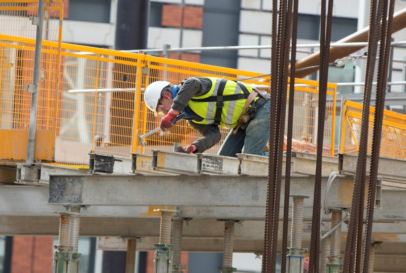 © Reuters. A construction worker works on a site in London