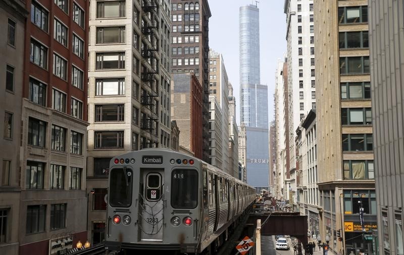 © Reuters. A subway car rides along the tracks towards The Trump International Hotel and Tower in downtown Chicago