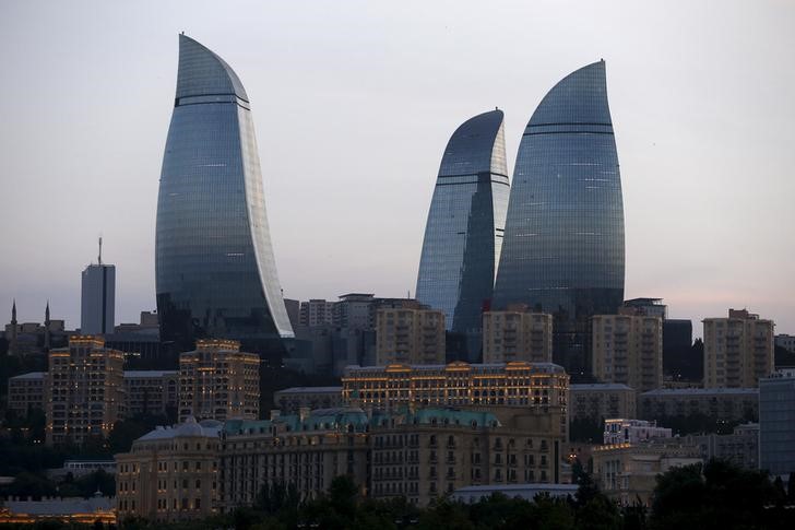 © Reuters. Flame Towers, one of Baku's famous skyscrapers is pictured at sunset in Azerbaijan