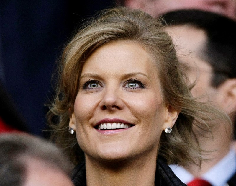 © Reuters. Dubai International Capital's chief negotiator Staveley smiles before the Champions League semi-final match in Liverpool