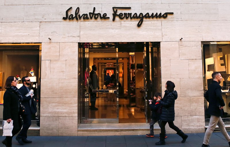 © Reuters. People walks past a Salvatore Ferragamo shop in downtown Rome