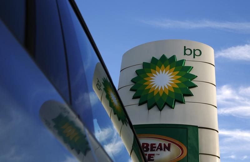 © Reuters. A BP logo is reflected in a car window at a petrol station in London