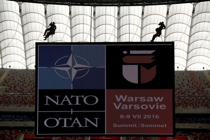 © Reuters. File photo of soldiers demonstrating their skills during a military police exercise, ahead of the NATO summit in July in Warsaw, at the PGE National Stadium in Warsaw