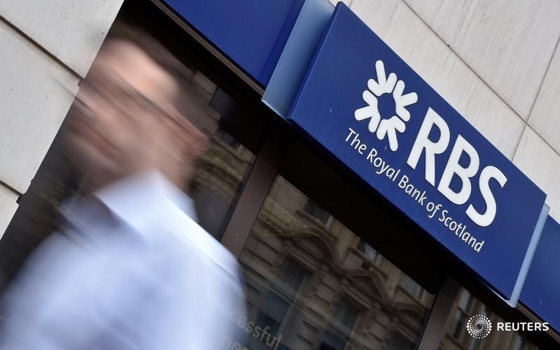 © Reuters. A man walks past a branch of The Royal Bank of Scotland in central London