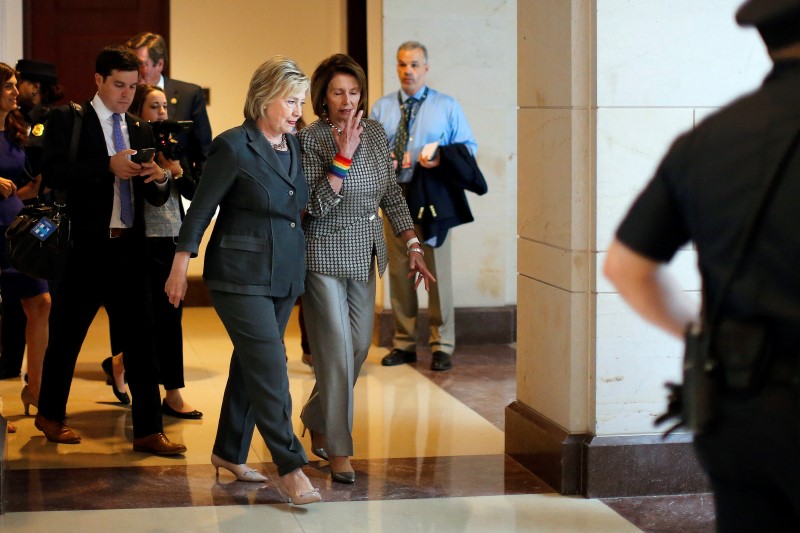 © Reuters. Democratic U.S. presidential candidate Hillary Clinton and U.S. House Minority Leader Nancy Pelosi leave a House Democratic Caucus meeting on Capitol Hill in Washington