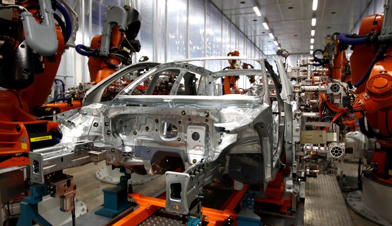 © Reuters. Robots connect side parts on Audi A3 light weight construction chassis at production line of German car manufacturer's plant in Ingolstadt