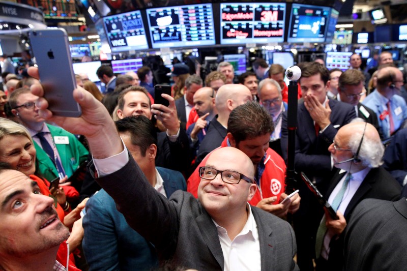 © Reuters. Jeff Lawson, Founder, CEO, & Chairman of Twilio takes a selfie photo during his company's IPO on the floor of the NYSE