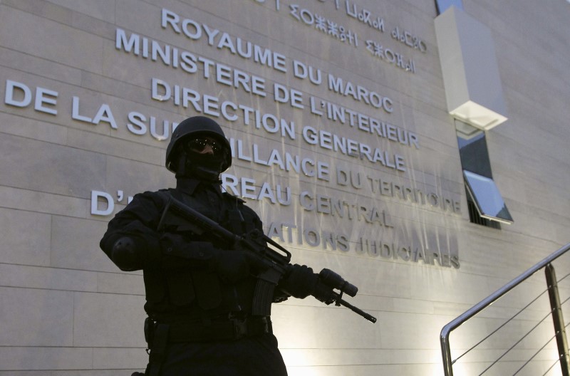 © Reuters. A Moroccan policeman stands guard at the Central Bureau of Judicial Investigation office in Sale