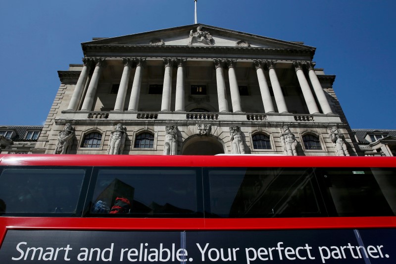 © Reuters. A bus passes the Bank of England in London