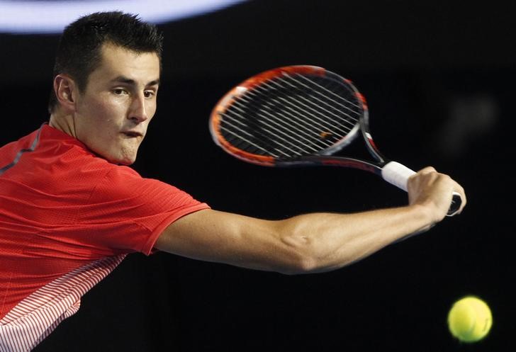© Reuters. Australia's Tomic hits a shot during his third round match against compatriot Millman at the Australian Open tennis tournament at Melbourne Park