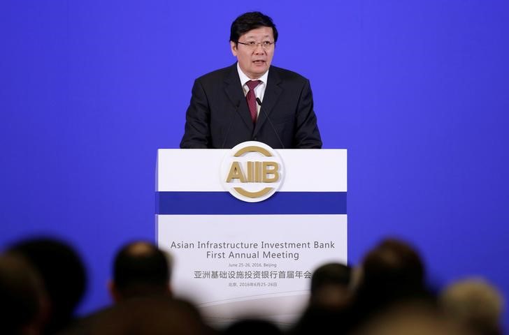 © Reuters. Chinese Finance Minister Lou Jiwei attends the opening ceremony of the first annual meeting of AIIB in Beijing