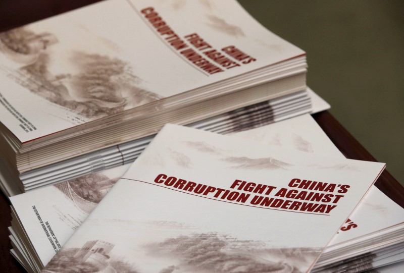 © Reuters. Copies of a booklet from the Central Commission for Discipline Inspection, the ruling Communist Party's anti-graft watchdog, is seen on a table during their news conference in Beijing