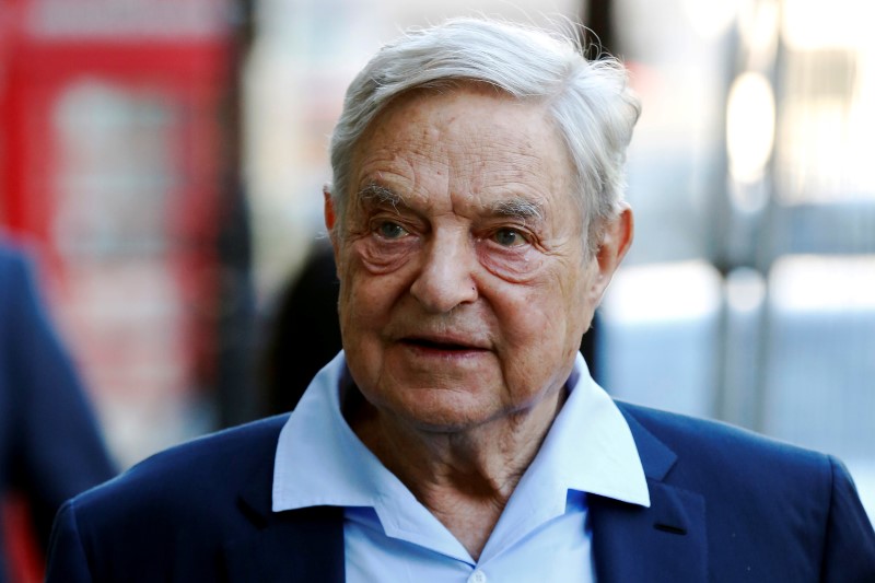 © Reuters. Business magnate George Soros arrives to speak at the Open Russia Club in London