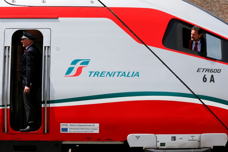 © Reuters. Trenitalia's conductors look before to leave by  Frecciargento's train at the Vatican railway station in Vatican