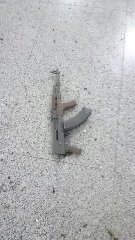 © Reuters. A weapon is seen on the floor at Ataturk airport after suicide bombers opened fire before blowing themselves up at the entrance, in Istanbul, Turkey