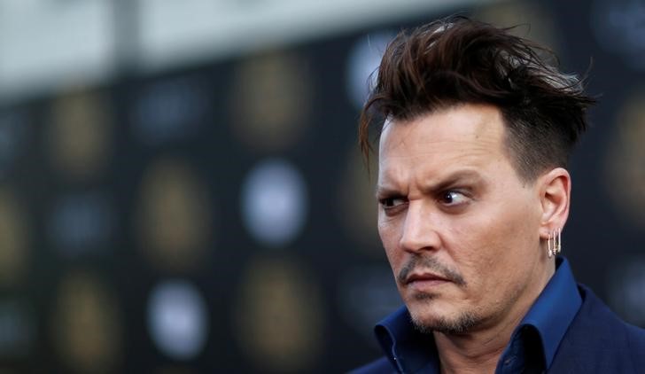 © Reuters. Johnny Depp subasta sus pinturas de Basquiat