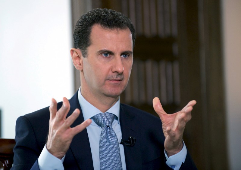 © Reuters. File photo of Syria's President Bashar al-Assad speaking during an interview with Russia's RIA new agency