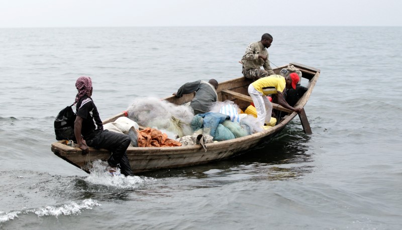 © Reuters. Fishermen set out for their expedition from the shores of Lake Kivu in Goma, eastern DRC
