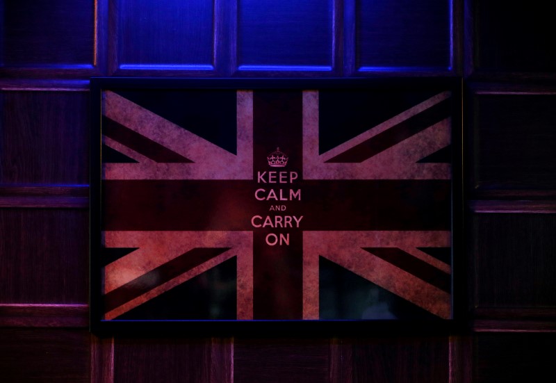 © Reuters. A poster of the Union Flag hangs on the wall of a British-themed bar in New Delhi