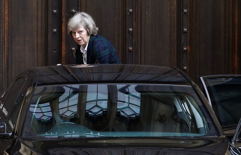 © Reuters. Britain's Home Secretary, Theresa May, gets into her car at Parliament in London