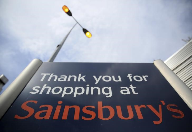 © Reuters. A sign is displayed at a Sainsbury's store in London